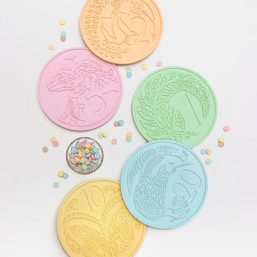 Five of the One Lane Bridge Candy Coins on a blank background