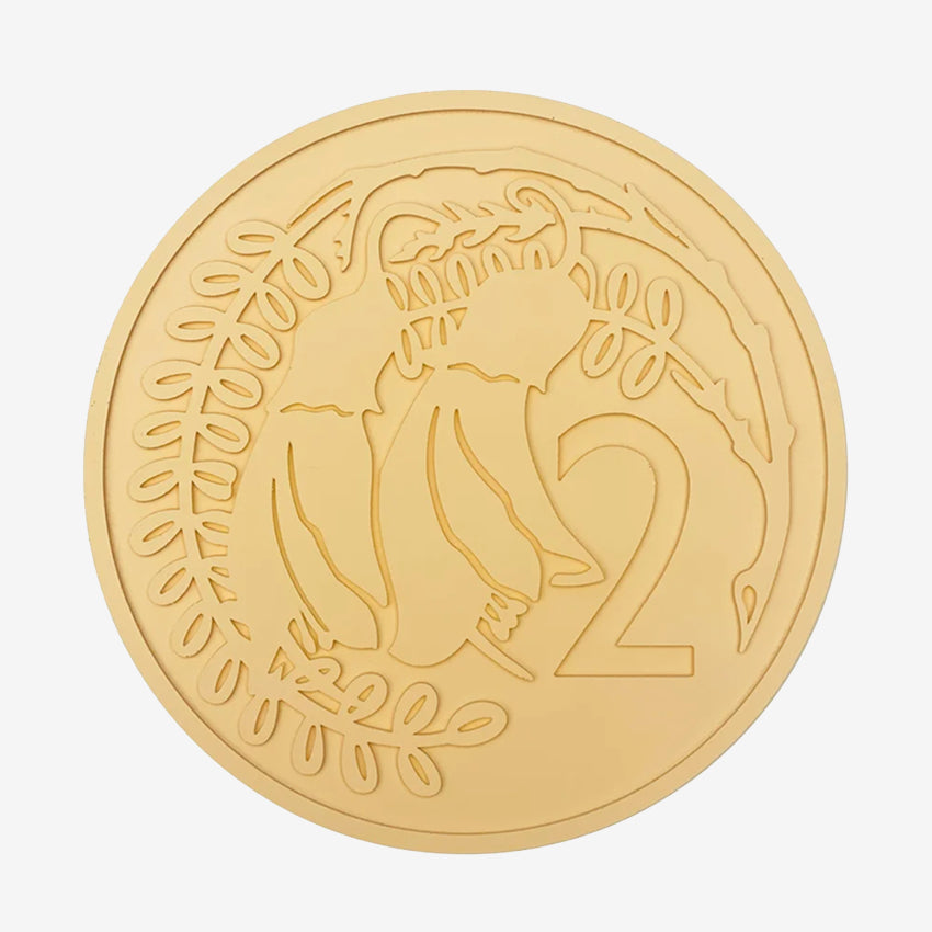 The One Lane Bridge 2 Cent Candy Coin in orange on a blank background
