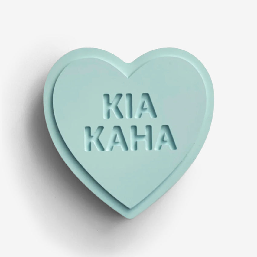The One Lane Bridge "Kia Kaha" Sweet Heart in blue on a blank background