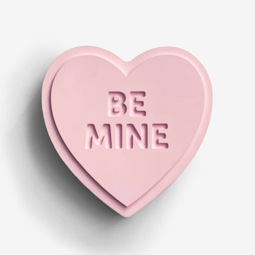 The One Lane Bridge "Be Mine" Sweet Heart in pink on a blank background