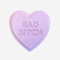 The One Lane Bridge "Bad Bitch" Unsweet Heart in Purple on a blank background