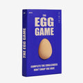 Blue box of 'The Egg Game' with a beige egg on a white background