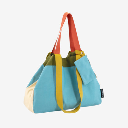The Remember Canvas Bag in Luca colourway on a grey background