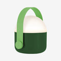The Remember Light Ole lamp in green on a grey background