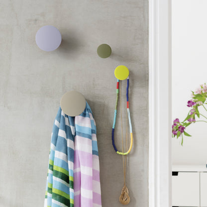 The Remember Homewares Tulip Wall Hooks set of 4 on a grey wall with jewellery and scarf hanging on them