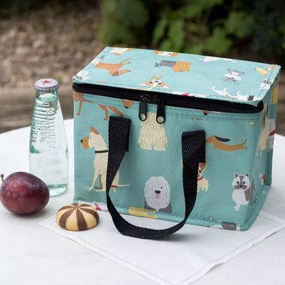 The Rex London Best In The Show Insulated Lunch Bag on a table with snacks