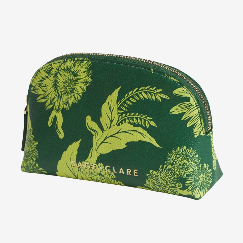 The Sage x Clare Delphine Cosmetic Pouch in Anise on a grey background