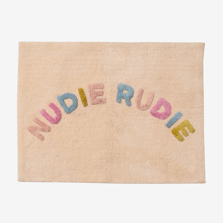 The Sage x Clare Tula Nudie Rudie Bath Mat in Tigre on a grey background
