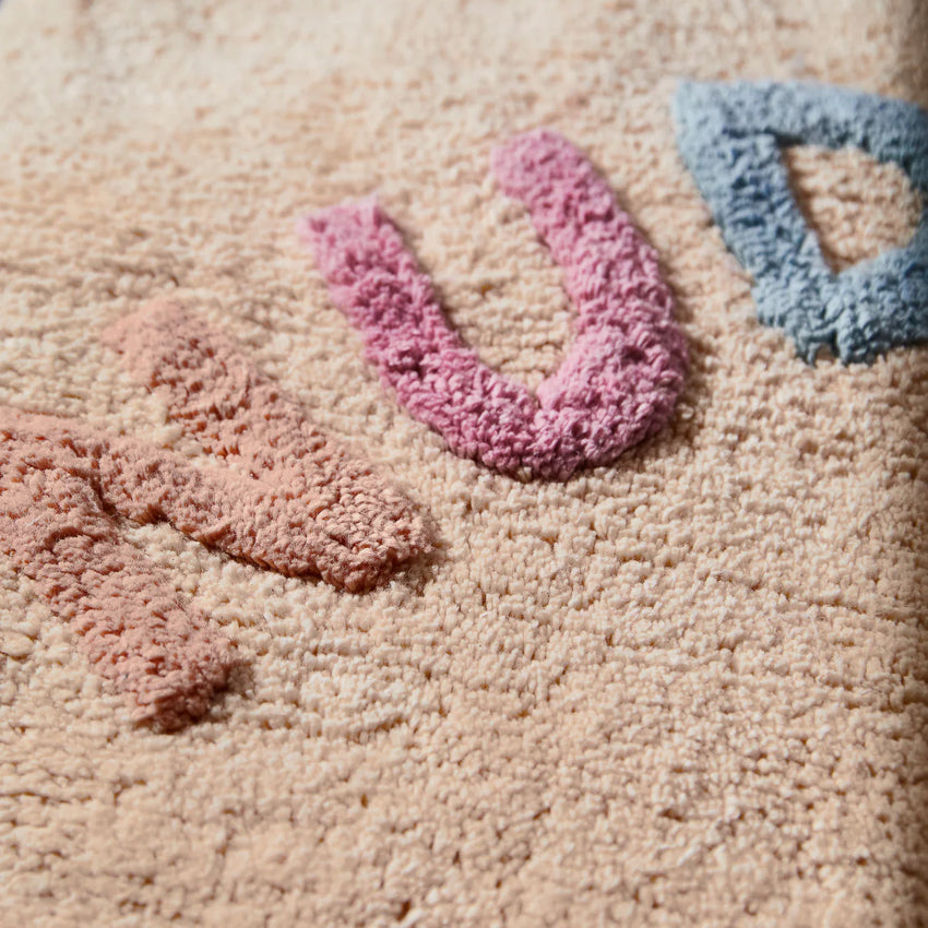 A close up of the Sage x Clare Tula Nudie Rudie Bath Mat in Tigre