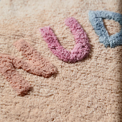 A close up of the Sage x Clare Tula Nudie Rudie Bath Mat in Tigre