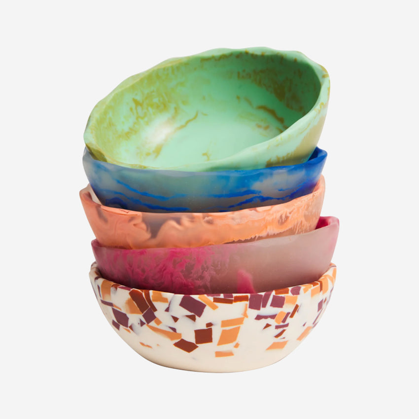 A stack of the Sage x Clare billie bowls in different colours on a blank background