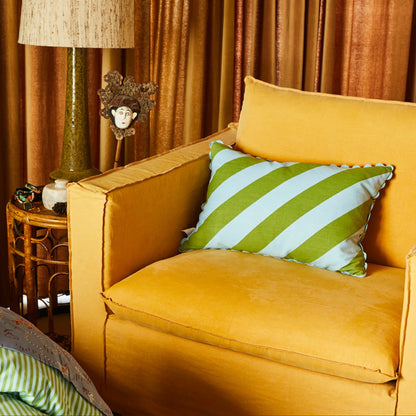 Sage x Clare Bundi Stripe Cushion in Sky on a mustard armchair