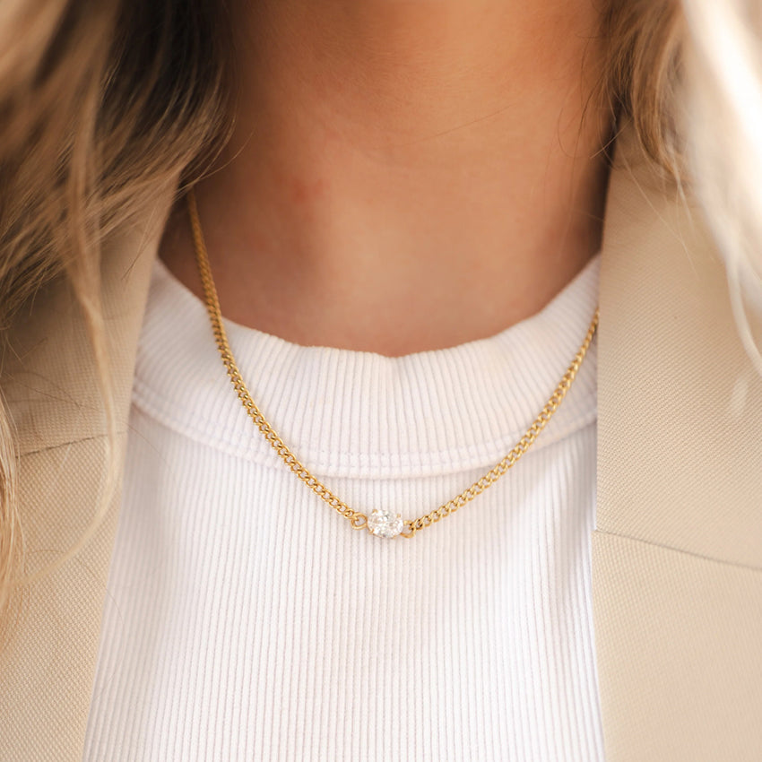 The Silver Linings Collective Cleo Necklace in Gold on a model 