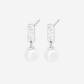 The Silver Linings Collective Luna Pearl Earrings in Silver on a blank background