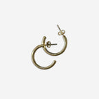 The Silver Linings Collective Navy Hoops in Gold on a blank background