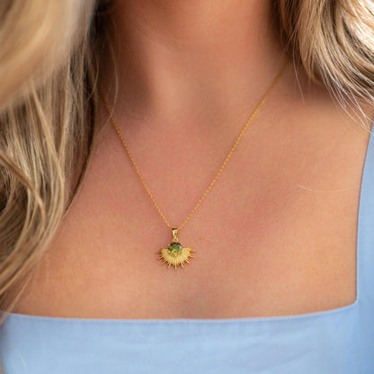 The Silver Linings Collective Solace Necklace with a Peridot Stone in Gold on a model