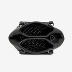 A top view of the Status Anxiety Astral Bag in Black open on a blank background