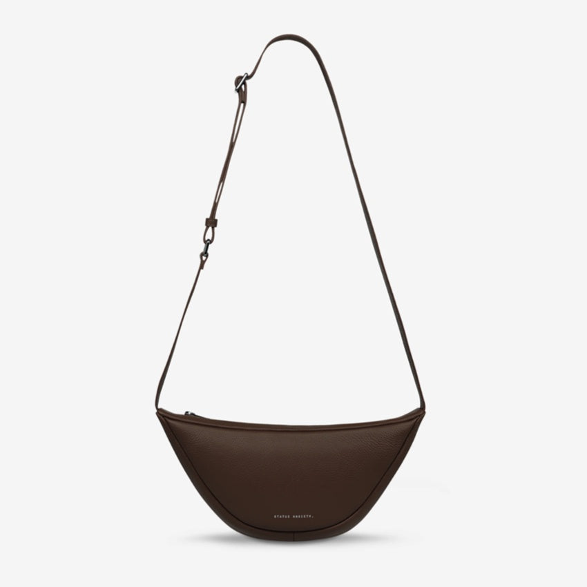 The Status Anxiety Glued To You Bag in Cocoa on a blank background
