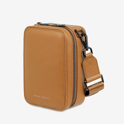 A side profile of the Status Anxiety Good Life Bag in Tan on a blank background