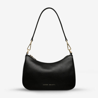 The Status Anxiety Look Both Ways in Black and Brush Gold on a blank background 