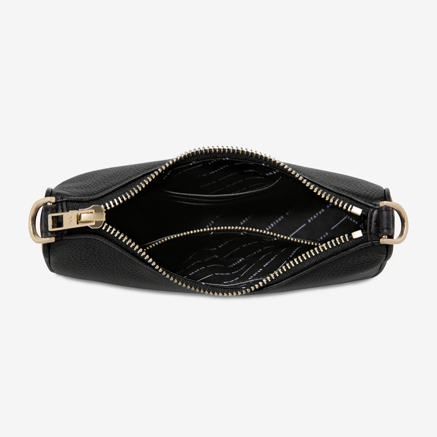 An inside view of the Status Anxiety Look Both Ways in Black and Brush Gold on a blank background 