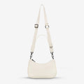 The Status Anxiety Look Both Ways Bag in Chalk on a grey background