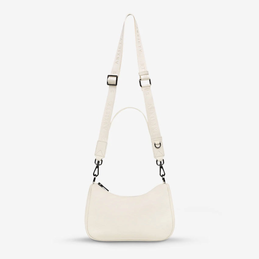 The Status Anxiety Look Both Ways Bag in Chalk on a grey background