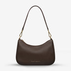 The Status Anxiety Look Both Ways in Cocoa and Brush Gold with shoulder strap on on a blank background 