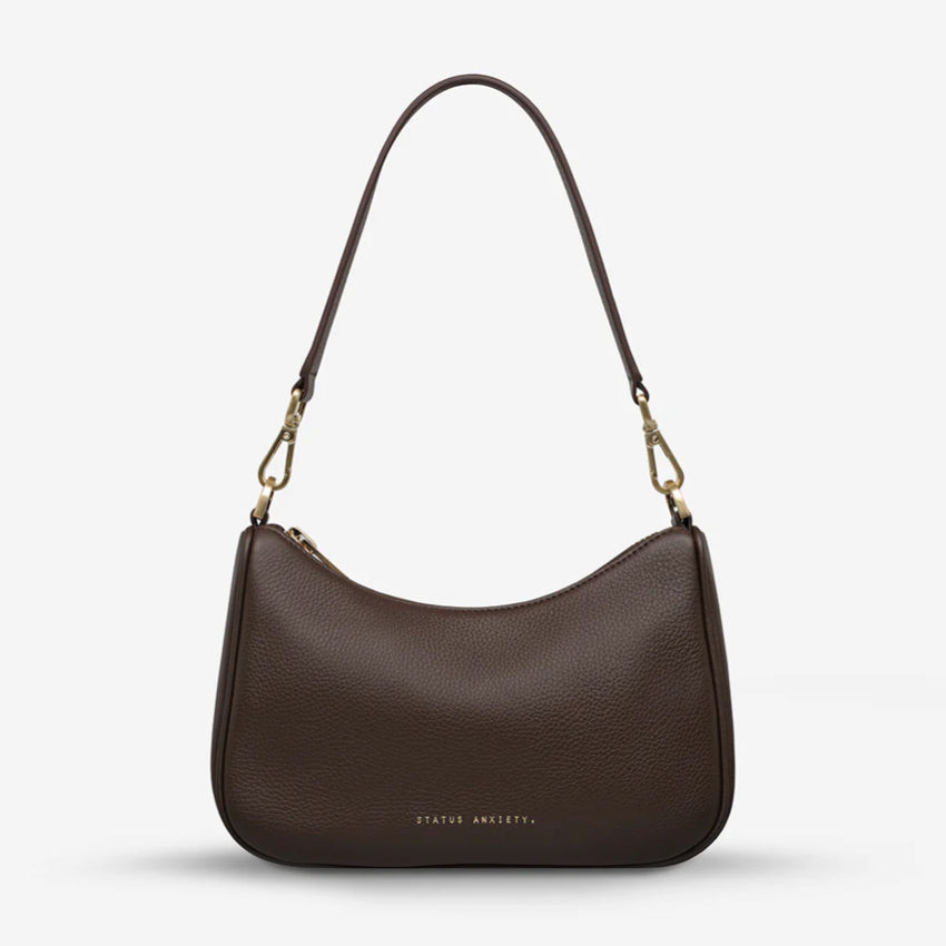 The Status Anxiety Look Both Ways in Cocoa and Brush Gold with shoulder strap on on a blank background 