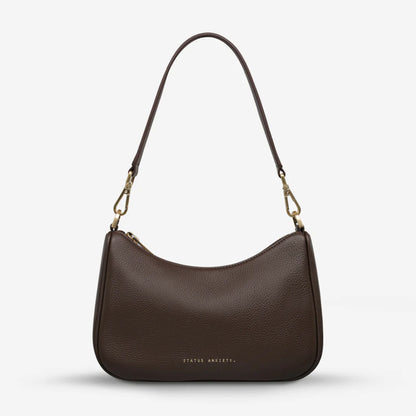 The Status Anxiety Look Both Ways in Cocoa and Brush Gold with shoulder strap on on a blank background 