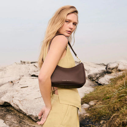 The Status Anxiety Look Both Ways in Cocoa and Brush Gold on a models shoulder 