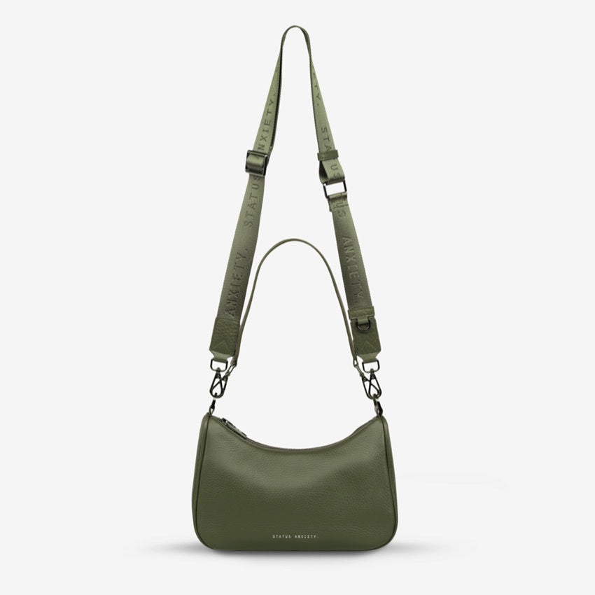 The Status Anxiety Look Both Ways Bag in Khaki on a grey background