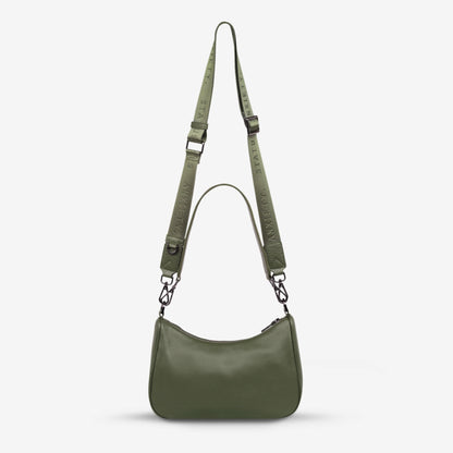 The Status Anxiety Look Both Ways Bag in Khaki on a grey background