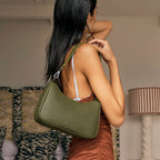 The Status Anxiety Look Both Ways Bag in Khaki on a models shoulder 