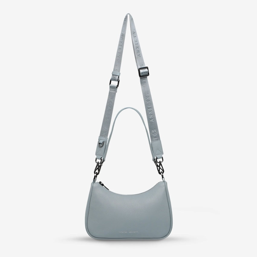 The Status Anxiety Look Both Ways in Powder Blue on a grey background