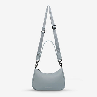 The Status Anxiety Look Both Ways in Powder Blue on a grey background