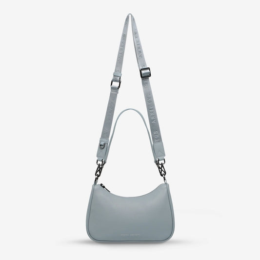 The Status Anxiety Look Both Ways in Powder Blue on a grey background