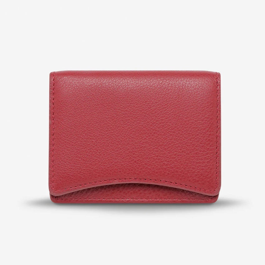 The Status Anxiety Lumen Wallet in Rouge on a blank background