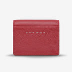 The back of the Status Anxiety Lumen Wallet in Rouge on a blank background