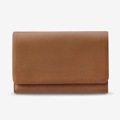 The Status Anxiety Remnant Wallet in Camel on a blank background