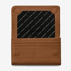 The Status Anxiety Remnant Wallet in Camel open on a blank background