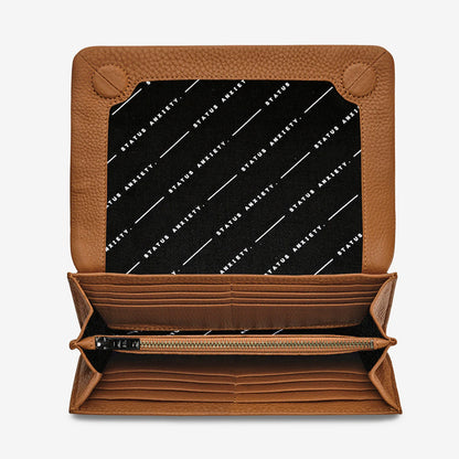 A top view of the Status Anxiety Remnant Wallet in Camel open on a blank background