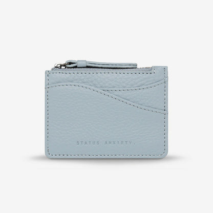 The Status Anxiety Hearts Still Beating Wallet in Powder Blue on a grey background