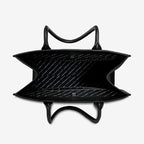 An inside view of the Status Anxiety Without Warning Bag in Black on a grey background
