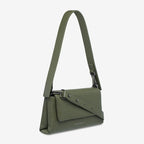 The Status Anxiety Zenith Bag in Khaki on a blank background with the long strapped wrapped around