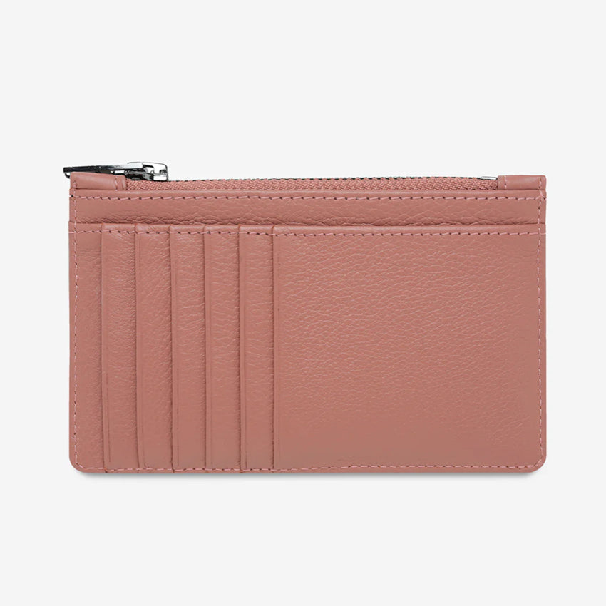 The Status Anxiety Avoiding Things Wallet in Dusty Pink on a blank background