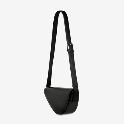 A side view of the Status Anxiety Ethereal Bag in Black on a blank background