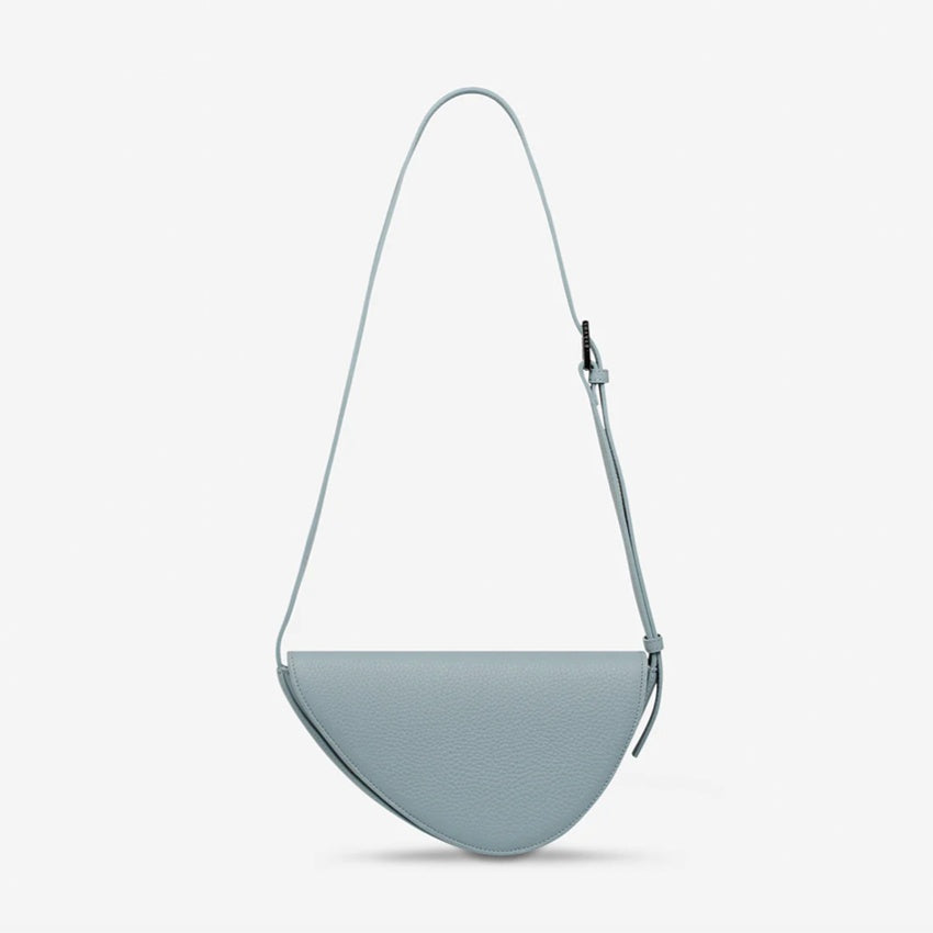 The Status Anxiety Ethereal Handbag in Powder Blue on a blank background