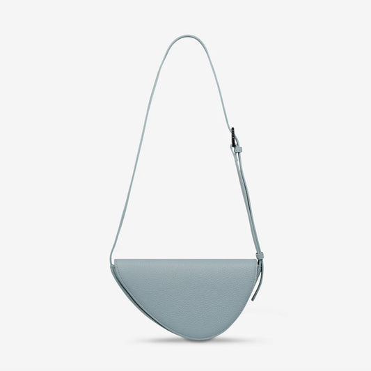 The Status Anxiety Ethereal Handbag in Powder Blue on a blank background