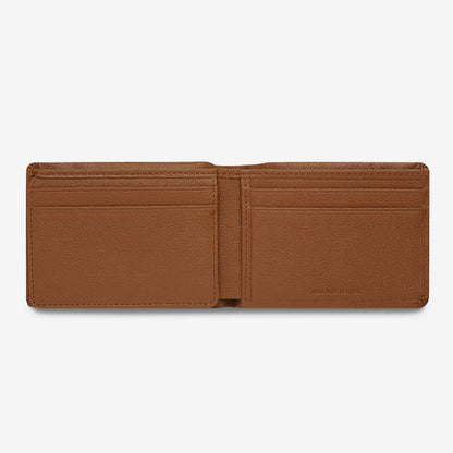 The Status Anxiety Jonah Wallet in Tan open on a blank background